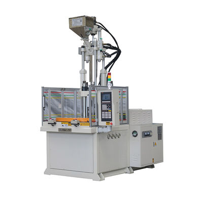 Machine de moulage par injection de plastique rotatif vertical à haut rendement pour la fabrication de poignées