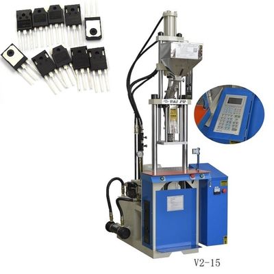 Machine de moulage par injection verticale pour la fabrication de composants de circuits