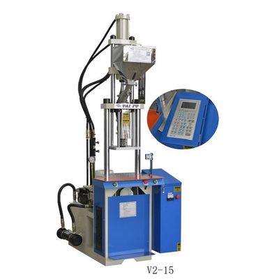 Machine de moulage par injection verticale pour la fabrication de composants de circuits