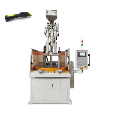 Machine de moulage par injection de plastique rotatif vertical à haut rendement pour la fabrication de poignées